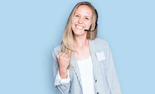 Woman holding pair of headphones